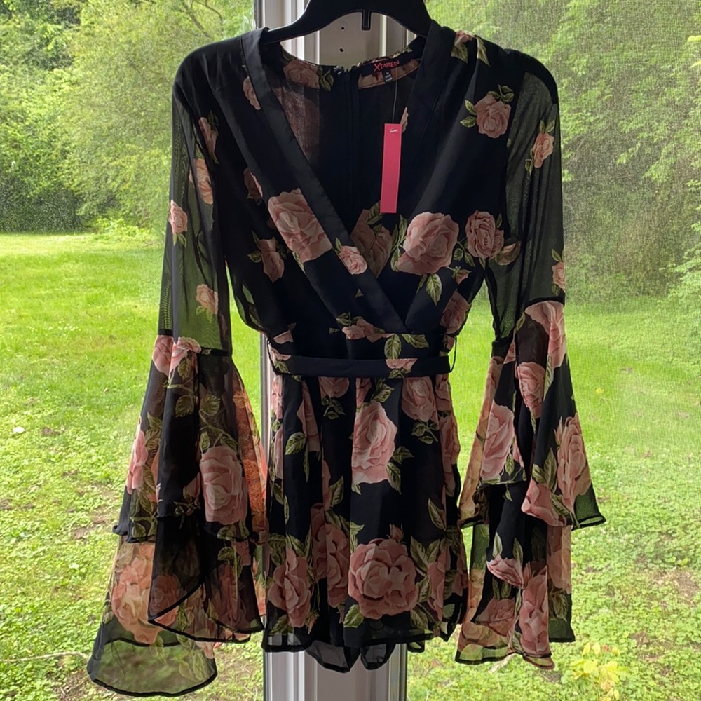 Black romper with pink roses. NWT.